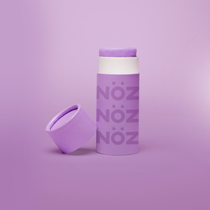 Single overall product view of Rainbow violet Nöz reef safe nose sunscreen.