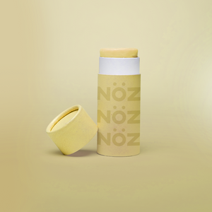 Single overall product view of Rainbow yellow Nöz reef safe nose sunscreen.